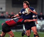 7 January 2000; Leinster's Denis Hickie is tackled by Ian Jardine of Glasgow Caledonians during the Heineken Cup Pool 1 Round 5 match between Leinster and Glasgow Caledonians at Donnybrook in Dublin. Photo by David Maher/Sportsfile