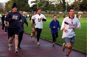 25 December 1999; Participants, including former World 5,000m Champion Eamonn Coghlan and his son John, at Belfield Running Track in Dublin, during one of the many 'Goal Miles' on Christmas Day. Photo by Ray McManus/Sportsfile