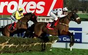 8 January 2000; Greenstead, with Paul Carberry up, clears the first ahead of Derrymoyle, with Conor O'Dwyer up, during the Ladbroke Hurdle at Leopardstown Racecourse in Dublin. Photo by Damien Eagers/Sportsfile