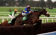 27 December 1999; Inis Cara, with Robby McNally up, jumps the last on their way to winning the Paddy Power Handicap Steeplechase, from Irish Light, with Tom Rudd up, at Leopardstown Racecourse in Dublin. Photo by Matt Browne/Sportsfile