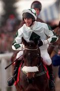 19 March 1998: Jockey John Thomas McNamara and Inniscein make their way to the start of the 128th Year Of National Hunt Chase Challenge Cup during day two of the Cheltenham Racing Festival at Prestbury Park in Cheltenham, England. Photo by Matt Browne/Sportsfile