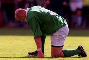 28 August 1999; Ireland's Keith Wood waits for assistance after taking a knock during the Rugby World Cup Warm-up match between Ireland and Argentina at Lansdowne Road in Dublin. Photo by Brendan Moran/Sportsfile