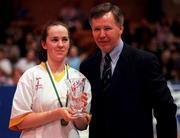 30 January 2000. Kim Fitzpatrick Wildcats is presented with the MVP award by Finn Ahern, President Irish Basketball Association, following the Women's Basketball Sprite Cup Final between Avonmore Wildcats and Meteors at the National Basketball Arena in Tallaght, Dublin. Photo by Brendan Moran/Sportsfile