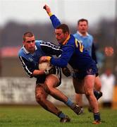 16 January 2000; Martin Cahill of Dublin in action against Sean Hagan of Longford during the O'Byrne Cup Semi-Final match between Longford and Dublin at Pearse Park in Longford. Photo by Damien Eagers/Sportsfile