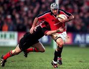 8 January 2000; Mike Mullins of Munster is tackled by Kevin Sorrell of Saracens during the Heineken Cup Pool 4 Round 5 match between Munster and Saracens at Thomond Park in Limerick. Photo by Brendan Moran/Sportsfile