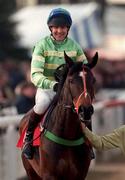 19 March 1998: Jockey Philip Fenton and Mr Moylan make their way to the start of the 128th Year Of National Hunt Chase Challenge Cup during day two of the Cheltenham Racing Festival at Prestbury Park in Cheltenham, England. Photo by Matt Browne/Sportsfile
