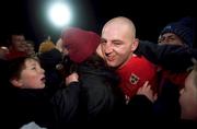 8 January 2000; Munster's Keith Wood celebrates his side's victory with supporters following the Heineken Cup Pool 4 Round 5 match between Munster and Saracens at Thomond Park in Limerick. Photo by Brendan Moran/Sportsfile