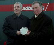8 January 2000; Trainer Pat Hughes, right, is presented with the winning trainers award by Charlie McCreevy T.D., Minister for Finance, after he sent out Mantles Prince to win the Ladbroke Hurdle at Leopardstown Racecourse in Dublin. Photo by Damien Eagers/Sportsfile