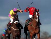 23 January 2000; Florida Pearl, with Paul Carberry up, right, races ahead of Amberleigh House, with Philip Carberry up, to win the Bax Global Handicap Steeplechase at Leopardstown Racecourse in Dublin. Photo by Ray Lohan/Sportsfile