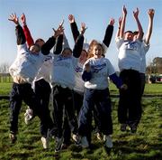 1 January 1999; Athletes celebrate finishing the first race of the century at the Papal Cross in Dublin's Phoenix Park. The race was a 4 mile Road race organised by Dublin City Harriers. Photo by Aoife Rice/Sportsfile