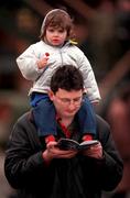 16 January 2000; Robert McGreevey and his two-and-a-half year old daughter Emily, from Blackrock, Dublin, during racing at Fairyhouse Racecourse in Meath. Photo by Ray McManus/Sportsfile