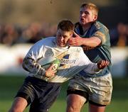 28 December 1999; Ronan O'Gara of Cork Constitution is tackled by Paul Neville of Garryowen during the AIB All-Ireland League Division 1 match between Cork Constitution and Garryowen at Temple Hill in Cork. Photo by Brendan Moran/Sportsfile