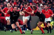 8 January 2000; Ronan O'Gara of Munster in action against Nick Walsh, left, and theirry Lacroix of Saracens during the Heineken Cup Pool 4 Round 5 match between Munster and Saracens at Thomond Park in Limerick. Photo by Brendan Moran/Sportsfile