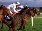 26 December 1999; Tryphaena, with Paul Carberry up, 12, on their way to winning the Move-Over-Butter Handicap Hurdle, from eventual second place Vanilla Man, left, and eventual third place Killulthagh Storm, with Barry Geraghty up, right, at Leopardstown Racecourse in Dublin. Photo by Ray McManus/Sportsfile