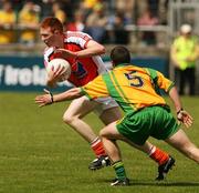 27 May 2007; Tony Donnelly, Armagh, in action against Kevin Mulhern, Donegal. ESB Ulster Minor Football Championship, Donegal v Armagh, MacCumhaill Park, Ballybofey, Co. Donegal. Picture credit: Oliver McVeigh / SPORTSFILE