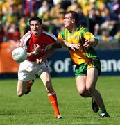 27 May 2007; Andy Mallon, Armagh, in action against Neil Gallagher, Donegal. Bank of Ireland Ulster Senior Football Championship, Donegal v Armagh, MacCumhaill Park, Ballybofey, Co. Donegal. Picture credit: Oliver McVeigh / SPORTSFILE