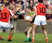 27 May 2007; Barry Dunnion, Donegal, in action against Steven McDonnell and Paddy McKeever, Armagh. Bank of Ireland Ulster Senior Football Championship, Donegal v Armagh, MacCumhaill Park, Ballybofey, Co. Donegal. Picture credit: Oliver McVeigh / SPORTSFILE