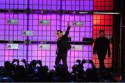 6 November 2014; Bono, Musician, Elevation Partners, waves to the crowd at the centre stage during Day 3 of the 2014 Web Summit in the RDS, Dublin, Ireland. Picture credit: Ramsey Cardy / SPORTSFILE / Web Summit