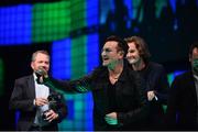 6 November 2014; Bono, Musician, Elevation Partners, gives a peace sign to the crowd at the centre stage during Day 3 of the 2014 Web Summit in the RDS, Dublin, Ireland. Picture credit: Ramsey Cardy / SPORTSFILE / Web Summit