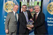 8 November 2014; Referee Declan Magee, from Down, is presented with his retiring referees' medal by Pat McEnaney, Chairman of National Referee Committee, left, and Frank Burke, Vice- President of Gaa. 2014 National Referees' Awards Banquet, Croke Park, Dublin. Picture credit: Barry Cregg / SPORTSFILE