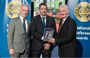 8 November 2014; Referee Syl Doyle, from Wexford, is presented with his retiring referees' award by Pat McEnaney, Chairman of National Referee Committee, left, and Frank Burke, Vice- President of Gaa. 2014 National Referees' Awards Banquet, Croke Park, Dublin. Picture credit: Barry Cregg / SPORTSFILE