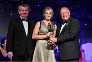 8 November 2014; Briege Corkery, Cork, is presented with her TG4 Ladies Football All-Star Award by Pat Quill, President of the Ladies Gaelic Football Association, in the company of Pól O Gallchóir, left, Ceannsaí, TG4. TG4 Ladies Football All-Star Awards 2014, Citywest Hotel, Saggart, Co. Dublin. Picture credit: Brendan Moran / SPORTSFILE