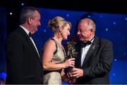 8 November 2014; Briege Corkery, Cork, is presented with her TG4 Ladies Football All-Star Award by Pat Quill, President of the Ladies Gaelic Football Association, in the company of Pól O Gallchóir, left, Ceannsaí, TG4. TG4 Ladies Football All-Star Awards 2014, Citywest Hotel, Saggart, Co. Dublin. Picture credit: Ray McManus / SPORTSFILE
