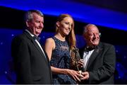 8 November 2014; Aishling Moloney, Tipperary, is presented with her TG4 Ladies Football Munster Young Player of the Year Award by Pat Quill, President of the Ladies Gaelic Football Association, in the company of Pól O Gallchóir, left, Ceannsaí, TG4. TG4 Ladies Football All-Star Awards 2014, Citywest Hotel, Saggart, Co. Dublin. Picture credit: Ray McManus / SPORTSFILE
