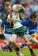 3 June 2007; &quot;Gearing Up for Cúl Camps&quot;. Pictured playing for the Vhi Cúl Camps Team in Croke Park on Sunday are Tom Lahiff, Bishop Galvin National School, representing Dublin, is tackled by Cian Byrne, St. Conleth's & Mary's, Newbridge, representing Kildare. Bank of Ireland Leinster Senior Football Championship, Meath v Dublin, Croke Park, Dublin. Picture Credit: Ray McManus / SPORTSFILE