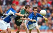 3 June 2007; &quot;Gearing Up for Cúl Camps&quot;. Pictured playing for the Vhi Cúl Camps Team in Croke Park on Sunday are Ross McKenna, Bishop Galvin National School, representing Dublin, is tackled by Cian Byrne, left, and Daniel Traynor, St. Conleth's & Mary's, Newbridge, representing Kildare. Bank of Ireland Leinster Senior Football Championship, Meath v Dublin, Croke Park, Dublin. Picture Credit: Ray McManus / SPORTSFILE