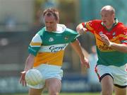 10 June 2007; Scott Brady, Offaly, in action against David Byrne, Carlow. Bank of Ireland Leinster Senior Football Championship, Carlow v Offaly, O'Moore Park, Portlaoise, Co. Laois. Picture credit: David Maher / SPORTSFILE