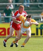 10 June 2007; Michael McCann, Antrim, in action against Fergal Doherty, Derry. Bank of Ireland Ulster Senior Football Championship Quarter-Final, Antrim v Derry, Casement Park, Belfast, Co. Antrim. Picture credit: Russell Pritchard / SPORTSFILE