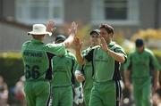 10 June 2007; Nanti Hayward, 66, Ireland, is congratulated by team-mate Tinnus Fourie after he cough the wicket of Ed Joyce, Middlesex. Friends Provident One Day Trophy, Ireland v Middlesex, Clontarf, Dublin. Picture credit: Matt Browne / SPORTSFILE