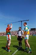 10 June 2007; Carlow captain Brian Kelly indicates the direction of play as referee Michael Daly and Offaly captain Alan Mcamee look on. Bank of Ireland Leinster Senior Football Championship, Carlow v Offaly, O'Moore Park, Portlaoise, Co. Laois. Picture credit: Brian Lawless / SPORTSFILE