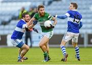 9 November 2014; Zach Touhy, Portlaoise, in action against Ger Brennan, left, and Tomas Quinn, right, St Vincent's. AIB Leinster GAA Football Senior Club Championship, Quarter-Final, Portlaoise v St Vincent's, O'Moore Park, Portlaoise, Co. Laois. Picture credit: Pat Murphy / SPORTSFILE
