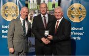8 November 2014; Referee Gearoid McGrath, from Dublin, is presented with his Allianz Hurling League D3A 2014 referees' medal by Pat McEnaney, Chairman of National Referee Committee, left, and Frank Burke, Vice-President of the GAA. 2014 National Referees' Awards Banquet, Croke Park, Dublin. Picture credit: Barry Cregg / SPORTSFILE