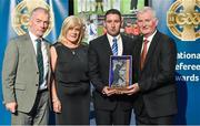 8 November 2014; Referee Fergal Horgan, from Tipperary, is presented with the Shane Hourigan Memorial award for Young Referee of the Year by Pat McEnaney, Chairman of National Referee Committee, left, Marie Hourigan and Frank Burke, Vice-President of the GAA. 2014 National Referees' Awards Banquet, Croke Park, Dublin. Picture credit: Barry Cregg / SPORTSFILE