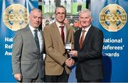 8 November 2014; Referee Fergal Kelly, from Longford, is presented with his Minor Football 2014 referees' medal by Pat McEnaney, Chairman of National Referee Committee, left, and Frank Burke, Vice-President of the GAA. 2014 National Referees' Awards Banquet, Croke Park, Dublin. Picture credit: Barry Cregg / SPORTSFILE