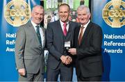 8 November 2014; Referee Conor Lane, from Cork, is presented with his Minor Football 2013 referees' medal by Pat McEnaney, Chairman of National Referee Committee, left, and Frank Burke, Vice-President of the GAA. 2014 National Referees' Awards Banquet, Croke Park, Dublin. Picture credit: Barry Cregg / SPORTSFILE