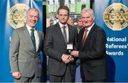 8 November 2014; Referee Owen Elliott, from Antrim, is presented with his U21 B Hurling 2014 referees' medal by Pat McEnaney, Chairman of National Referee Committee, left, and Frank Burke, Vice-President of the GAA. 2014 National Referees' Awards Banquet, Croke Park, Dublin. Picture credit: Barry Cregg / SPORTSFILE