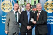 8 November 2014; Referee Justin Heffernan, from Wexford, is presented with his Minor B Hurling 2013 referees' medal by Pat McEnaney, Chairman of National Referee Committee, left, and Frank Burke, Vice-President of the GAA. 2014 National Referees' Awards Banquet, Croke Park, Dublin. Picture credit: Barry Cregg / SPORTSFILE