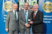8 November 2014; Referee John Keenan, from Wicklow, is presented with his Junior Club Hurling Replay 2014 referees' medal by Pat McEnaney, Chairman of National Referee Committee, left, and Frank Burke, Vice-President of the GAA. 2014 National Referees' Awards Banquet, Croke Park, Dublin. Picture credit: Barry Cregg / SPORTSFILE