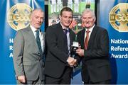 8 November 2014; Referee James Clarke, from Cavan, is presented with his Lory Meagher Cup 2014 referees' medal by Pat McEnaney, Chairman of National Referee Committee, left, and Frank Burke, Vice- President of the GAA. 2014 National Referees' Awards Banquet, Croke Park, Dublin. Picture credit: Barry Cregg / SPORTSFILE