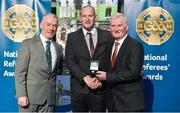 8 November 2014; Referee Gearoid McGrath, from Dublin, is presented with his Allianz Hurling League D3A 2014 referees' medal by Pat McEnaney, Chairman of National Referee Committee, left, and Frank Burke, Vice-President of the GAA. 2014 National Referees' Awards Banquet, Croke Park, Dublin. Picture credit: Barry Cregg / SPORTSFILE