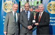 8 November 2014; Referee Cormac Reilly, from Meath, is presented with his Allianz Football League D1 2014 referees' medal by Pat McEnaney, Chairman of National Referee Committee, left, and Frank Burke, Vice-President of the GAA. 2014 National Referees' Awards Banquet, Croke Park, Dublin. Picture credit: Barry Cregg / SPORTSFILE