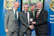8 November 2014; Referee Barry Cassidy, from Derry, is presented with his U21 Football final 2014 referees' medal by Pat McEnaney, Chairman of National Referee Committee, left, and Frank Burke, Vice-President of the GAA. 2014 National Referees' Awards Banquet, Croke Park, Dublin. Picture credit: Barry Cregg / SPORTSFILE