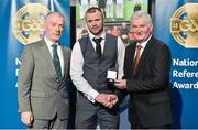 8 November 2014; Referee Anthony Nolan, from Wicklow, is presented with his Intermediate Club Final 2014 referees' medal by Frank Burke, Vice-President of the GAA. 2014 National Referees' Awards Banquet, Croke Park, Dublin. Picture credit: Barry Cregg / SPORTSFILE