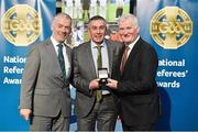 8 November 2014; Referee Garrett Duffy, from Antrim, is presented with his Allianz Hurling League D2B 2013 referees' medal by Pat McEnaney, Chairman of National Referee Committee, left, and Frank Burke, Vice-President of the GAA. 2014 National Referees' Awards Banquet, Croke Park, Dublin. Picture credit: Barry Cregg / SPORTSFILE