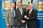 8 November 2014; Referee Liam McAuley, from Antrim, is presented with his Lory Meagher Cup 2013 referees' medal by Pat McEnaney, Chairman of National Referee Committee, left, and Frank Burke, Vice-President of the GAA. 2014 National Referees' Awards Banquet, Croke Park, Dublin. Picture credit: Barry Cregg / SPORTSFILE