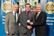 8 November 2014; Referee Martin McNally, from Monaghan, is presented with his Junior Club Football 2014 referees' medal by Pat McEnaney, Chairman of National Referee Committee, left, and Frank Burke, Vice-President of the GAA. 2014 National Referees' Awards Banquet, Croke Park, Dublin. Picture credit: Barry Cregg / SPORTSFILE